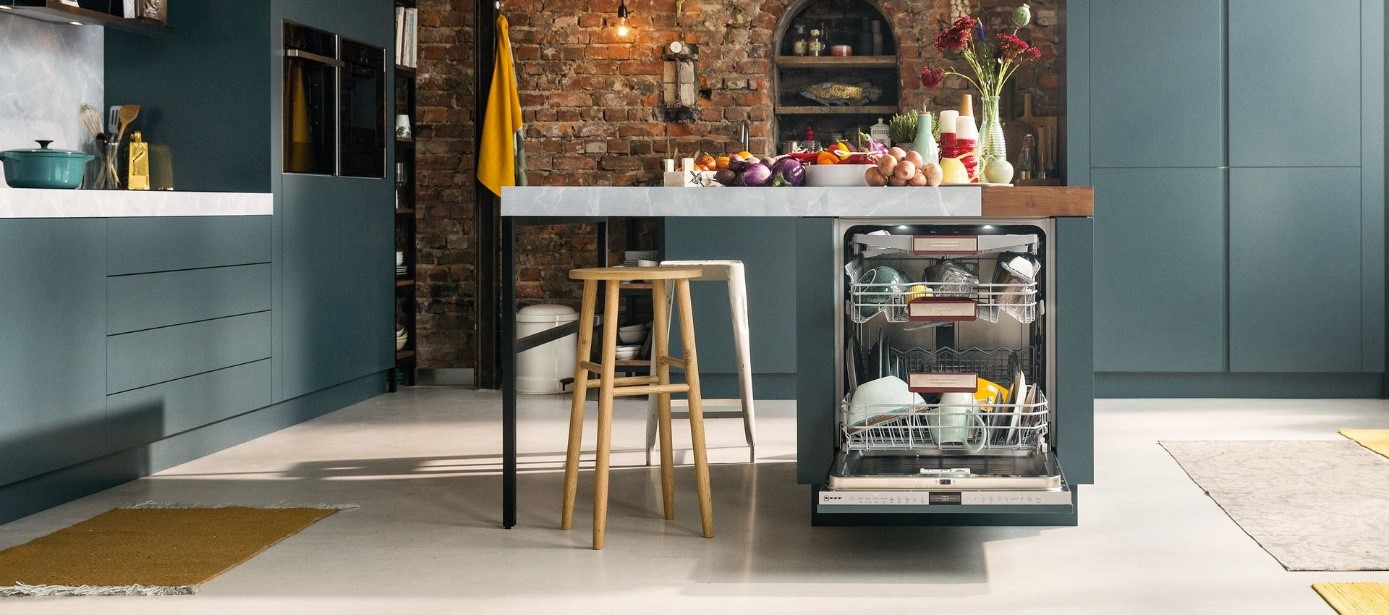 A modern kitchen with a dishwasher open and various kitchen items on the counter.